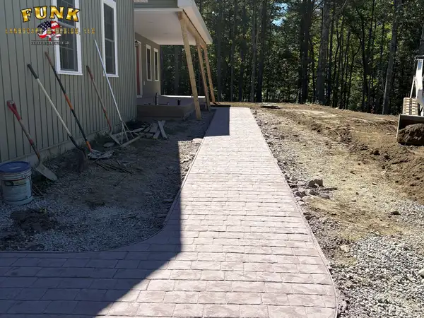 Finished retaining wall seen from the deck above, built by Funk Landscape & Design