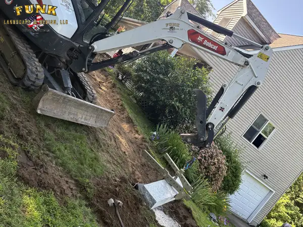 Paver landing and granite steps under construction