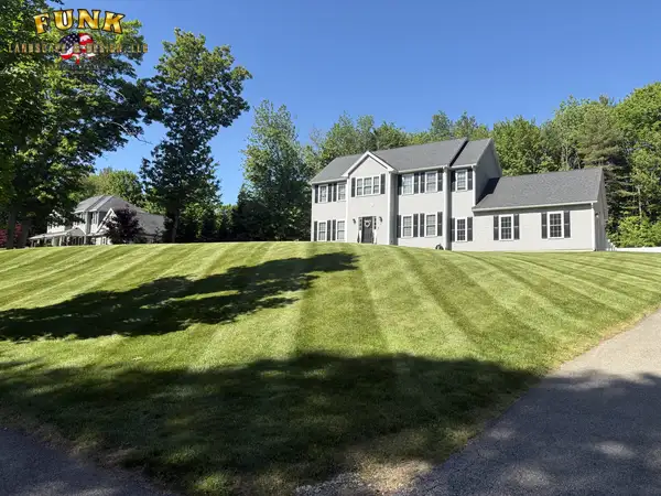 Crisp diagonal mowing stripes on a residential lawn